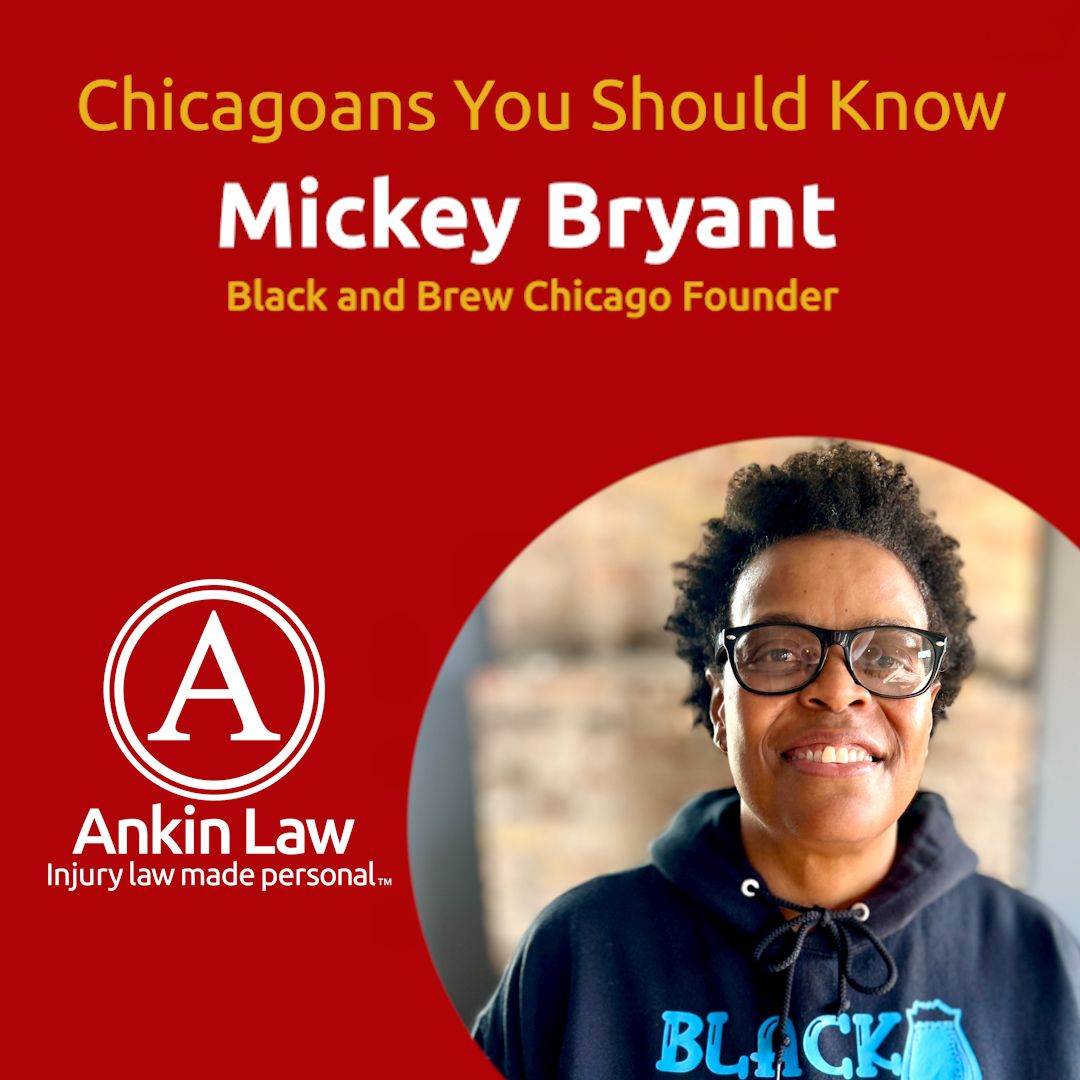 Mickey Bryant smiling with glasses and hoodie.